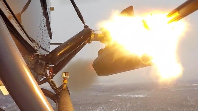 Close-up picture of firing of laser-guided rocket from a H145M helicopter