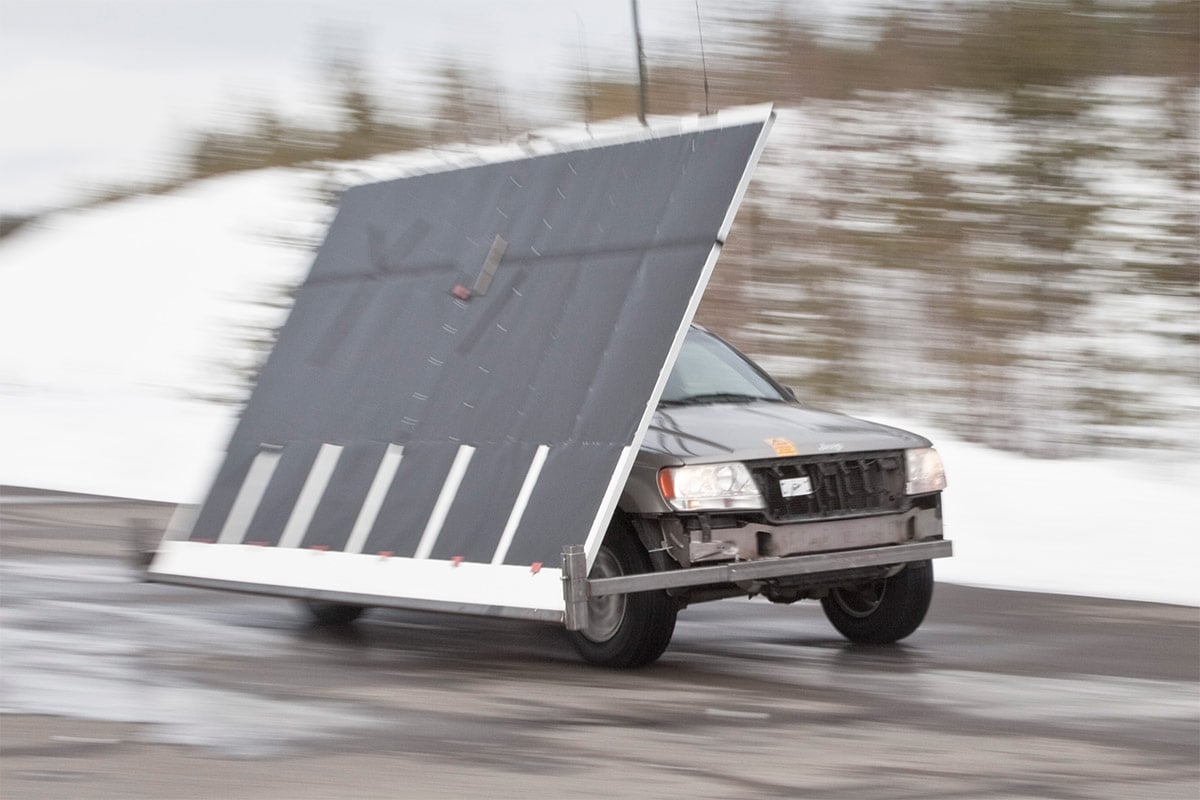 A vehicle carrying a large shield on the side to indicate IR signature