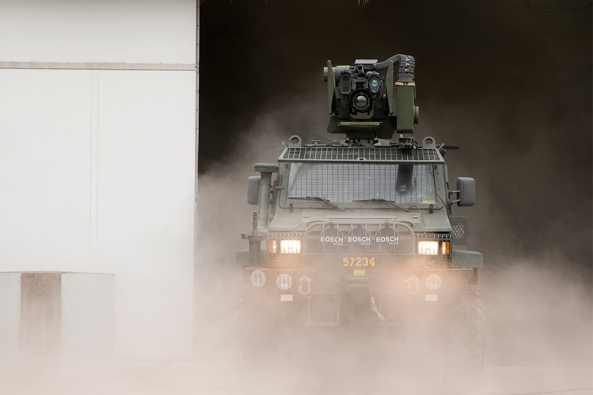 Vehicle coming out from the mist inside the climate chamber