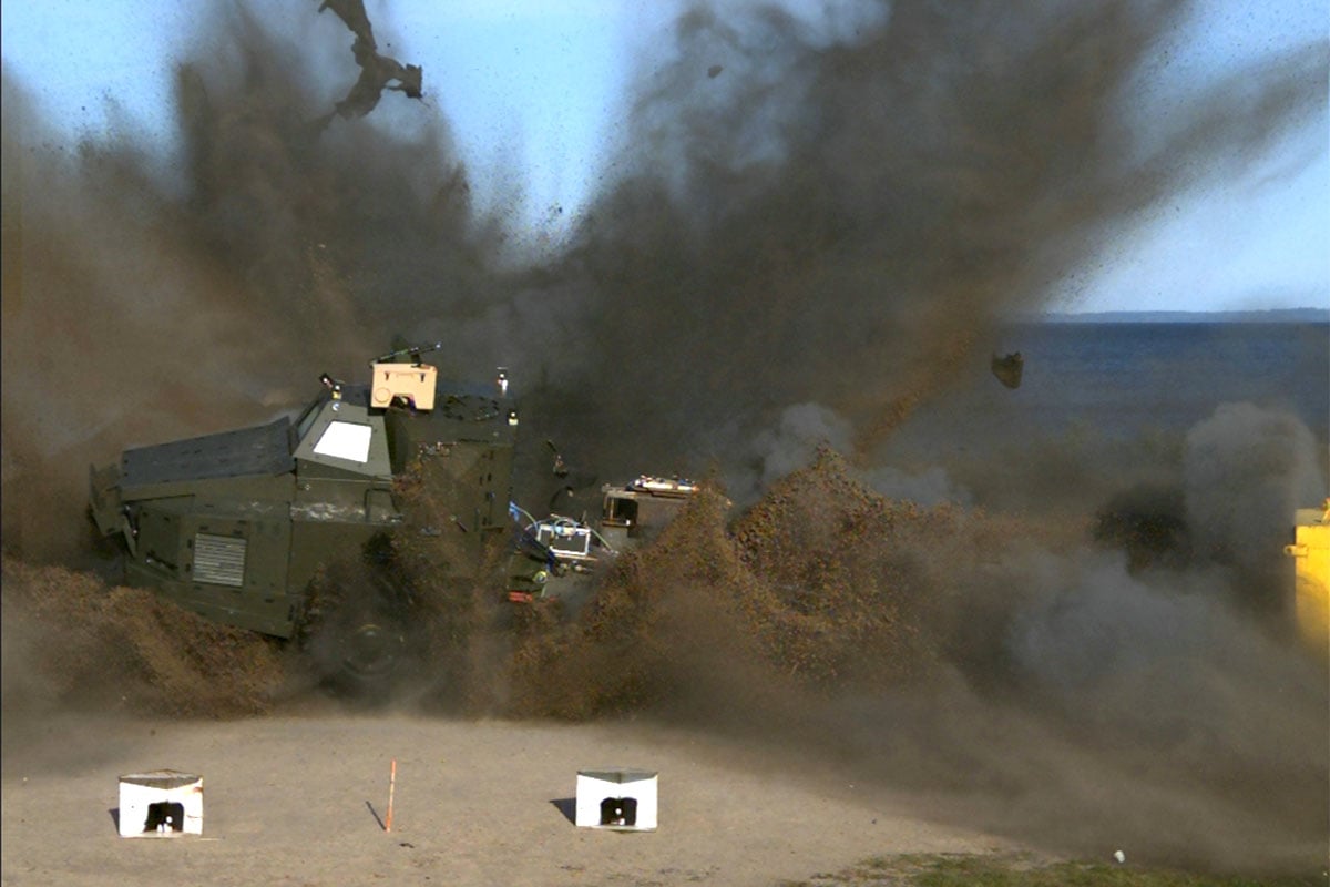 Survivability testing showing a vehicle exploding in black smoke